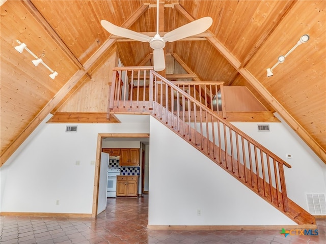 staircase featuring track lighting, ceiling fan, high vaulted ceiling, and wooden ceiling