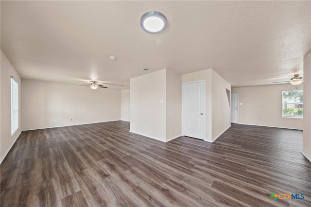2007 Jefferson Ct, Belton, TX 76513 - unfurnished living room featuring a ceiling fan and dark wood-style floors
