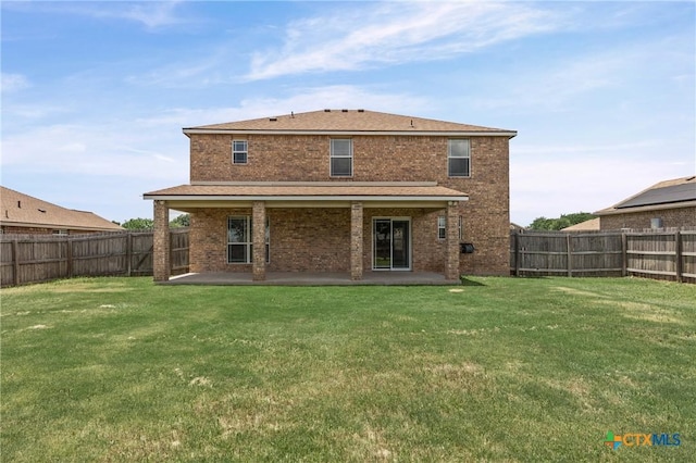 2007 Jefferson Ct, Belton, TX 76513 - back of house featuring a fenced backyard, brick siding, and a patio