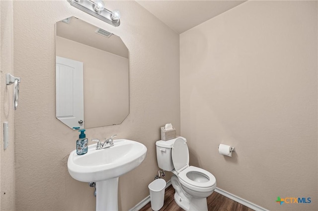 2007 Jefferson Ct, Belton, TX 76513 - bathroom featuring wood finished floors and toilet