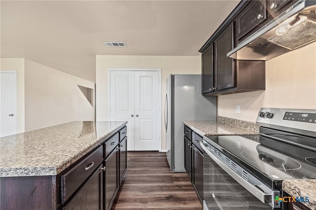 2007 Jefferson Ct, Belton, TX 76513 - kitchen with appliances with stainless steel finishes, under cabinet range hood, dark wood-type flooring, dark brown cabinetry, and a kitchen island