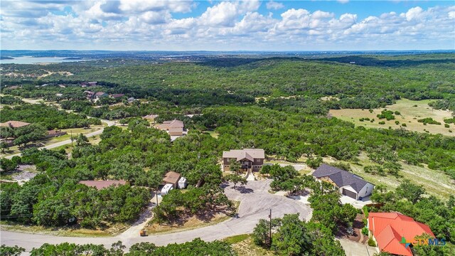bird's eye view featuring a forest view