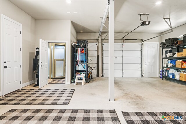 garage featuring a garage door opener