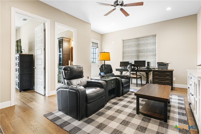 living area with wood finished floors, baseboards, visible vents, ceiling fan, and recessed lighting
