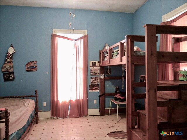 bedroom with tile patterned floors