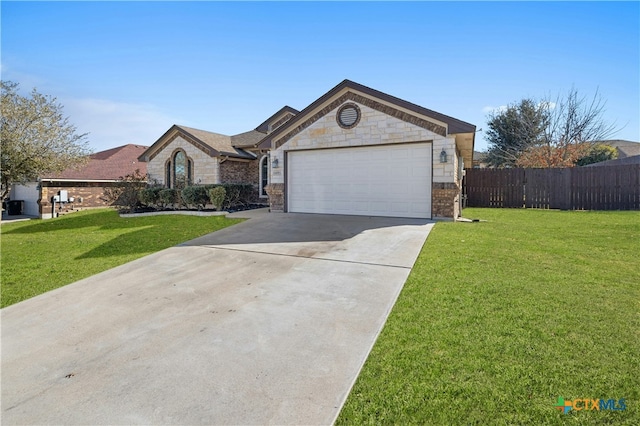 single story home featuring a garage and a front lawn