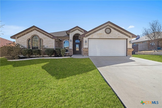 ranch-style home with a garage and a front lawn