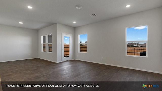 empty room with dark hardwood / wood-style flooring