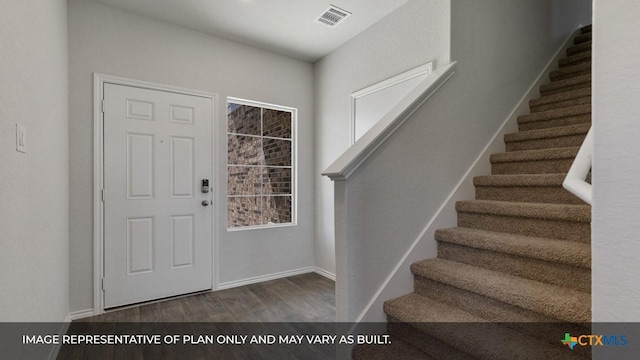 foyer with dark hardwood / wood-style flooring