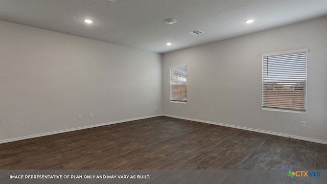 unfurnished room featuring dark wood-type flooring