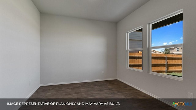 spare room featuring dark wood-type flooring