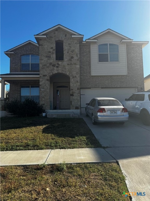 front facade with a garage