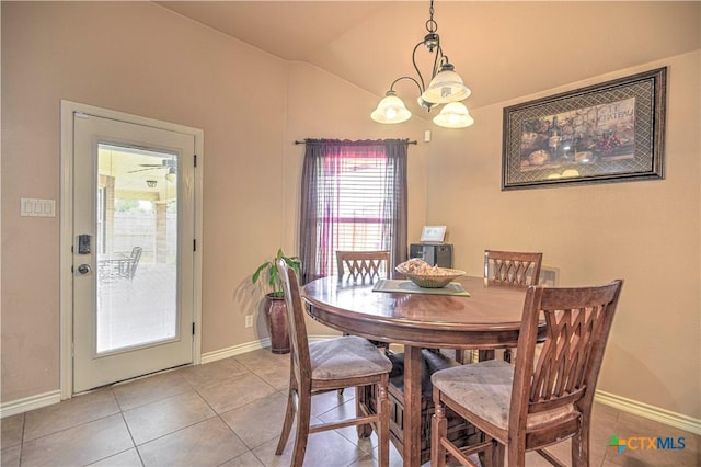 4813 Sapphire Dr, Killeen, TX 76542 - dining area featuring light tile patterned floors, lofted ceiling, and baseboards