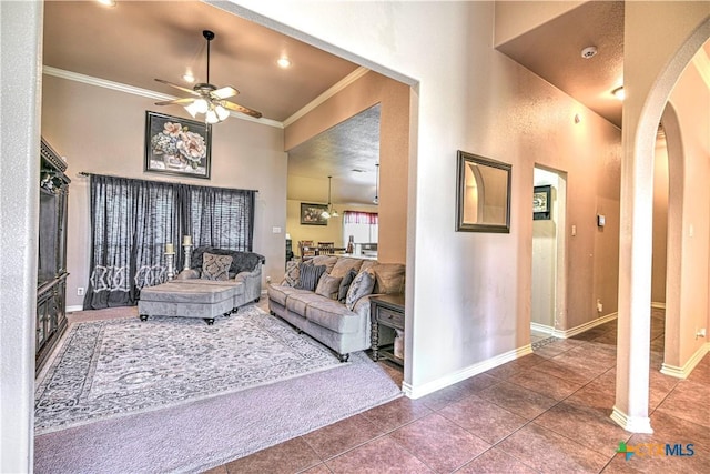 4813 Sapphire Dr, Killeen, TX 76542 - living area featuring ornamental molding, a ceiling fan, baseboards, tile patterned floors, and arched walkways
