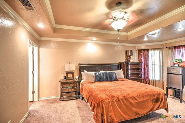 4813 Sapphire Dr, Killeen, TX 76542 - bedroom with carpet floors, a textured wall, a tray ceiling, baseboards, and crown molding