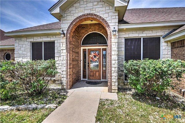 4813 Sapphire Dr, Killeen, TX 76542 - entrance to property featuring roof with shingles, brick siding, and stone siding