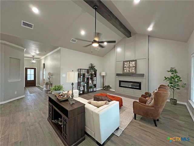 living room with ceiling fan, vaulted ceiling with beams, wood-type flooring, and a large fireplace