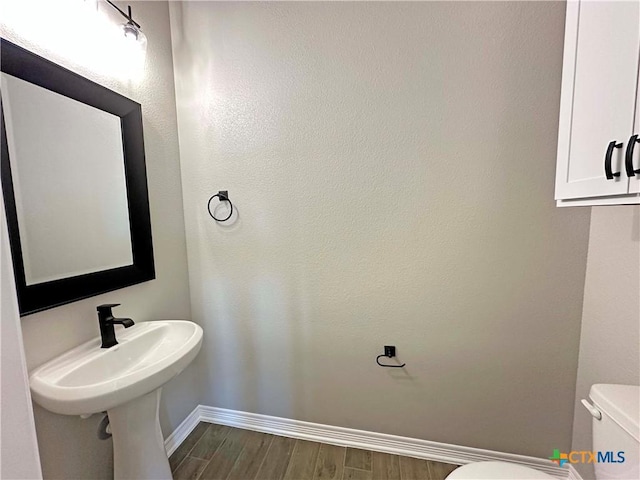 bathroom with toilet and sink