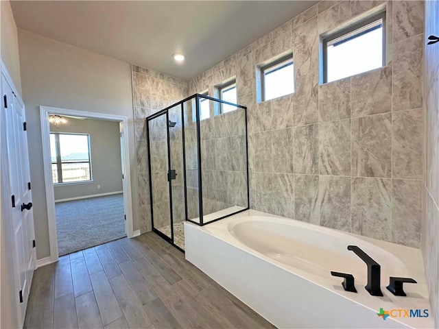 bathroom featuring plus walk in shower