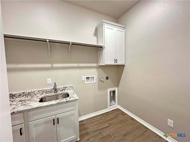 washroom with sink, cabinets, electric dryer hookup, gas dryer hookup, and hookup for a washing machine