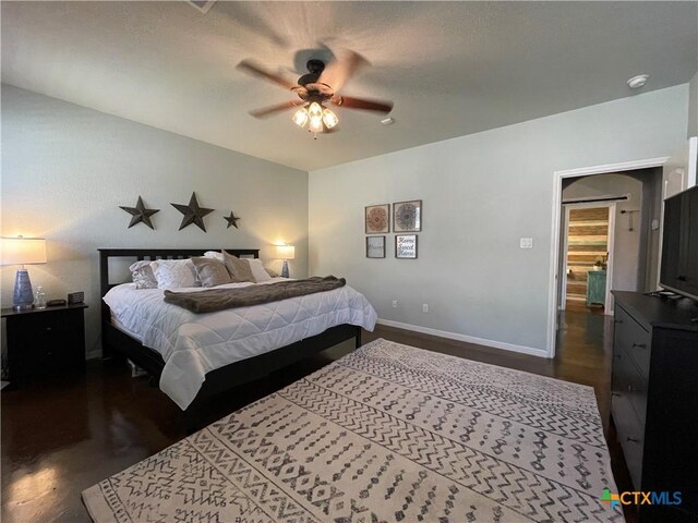 bedroom featuring a textured ceiling and ceiling fan