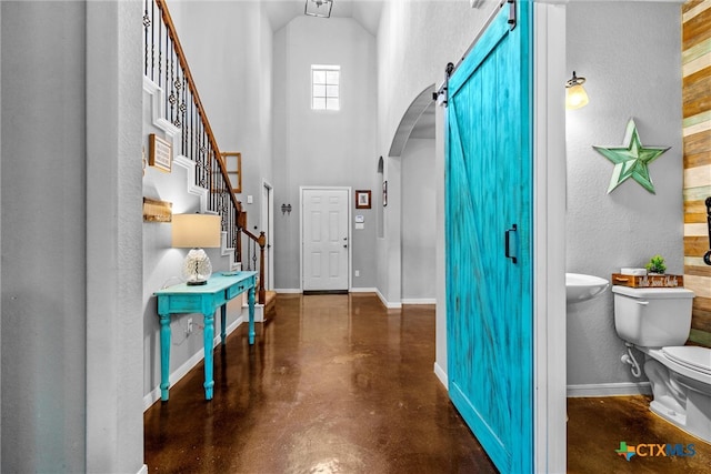 entrance foyer with a barn door