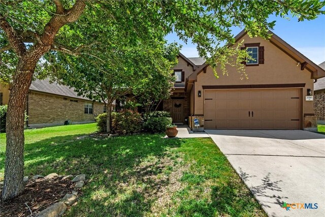 2090 Western Pecan, New Braunfels, TX 78130 - view of front of house featuring a front lawn, stucco siding, and concrete driveway