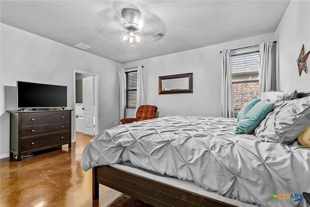 bedroom featuring a textured ceiling, ensuite bath, and ceiling fan