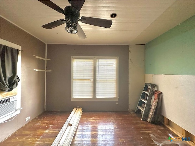 unfurnished room with ceiling fan and dark wood-type flooring