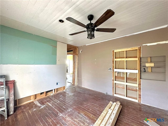 spare room featuring ceiling fan and dark hardwood / wood-style floors