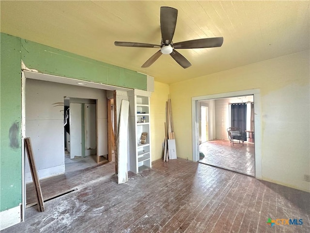 unfurnished bedroom with ceiling fan and hardwood / wood-style floors