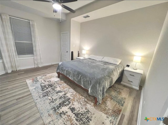 bedroom featuring ceiling fan and light hardwood / wood-style flooring