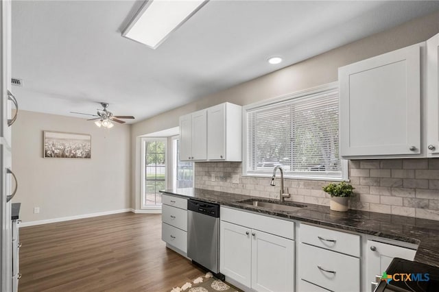 103 Aberdeen St, Victoria, TX 77904 - kitchen with dishwasher, a sink, backsplash, white cabinetry, and ceiling fan
