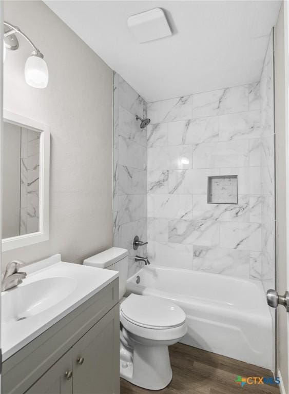 103 Aberdeen St, Victoria, TX 77904 - full bathroom with vanity, wood finished floors, bathing tub / shower combination, and toilet