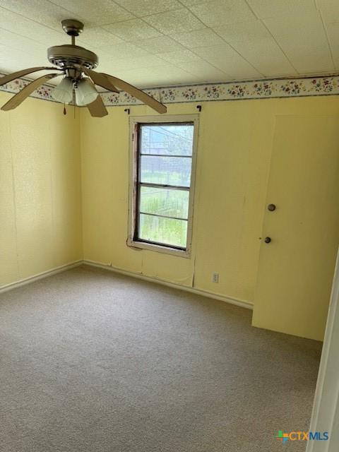 3205 Meadowlane St, Victoria, TX 77901 - carpeted empty room featuring ceiling fan