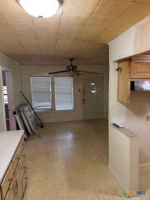 3205 Meadowlane St, Victoria, TX 77901 - kitchen featuring a ceiling fan, light floors, light countertops, and ventilation hood