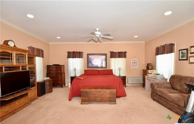 carpeted bedroom with a wall unit AC, ceiling fan, and crown molding