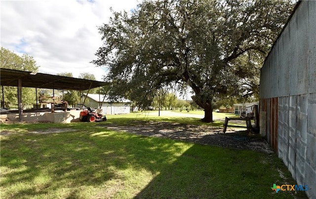 view of yard featuring a carport