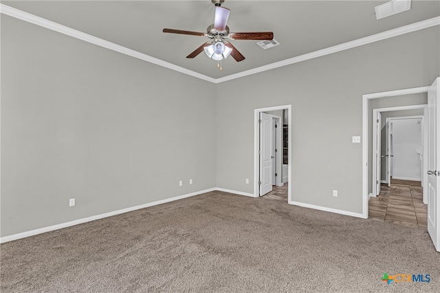 unfurnished room with ceiling fan, carpet flooring, and ornamental molding