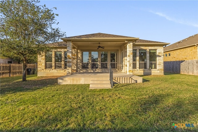 rear view of house featuring a patio area, a lawn, and ceiling fan