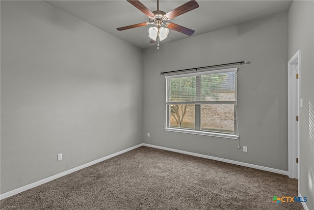 spare room featuring ceiling fan and carpet flooring