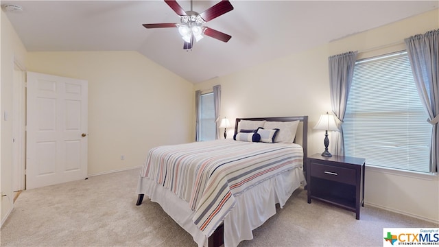 carpeted bedroom featuring ceiling fan and lofted ceiling