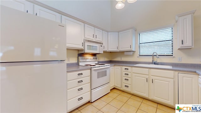 kitchen featuring light tile patterned floors, sink, white appliances, and white cabinetry