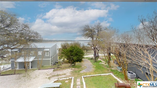 view of yard featuring central AC unit