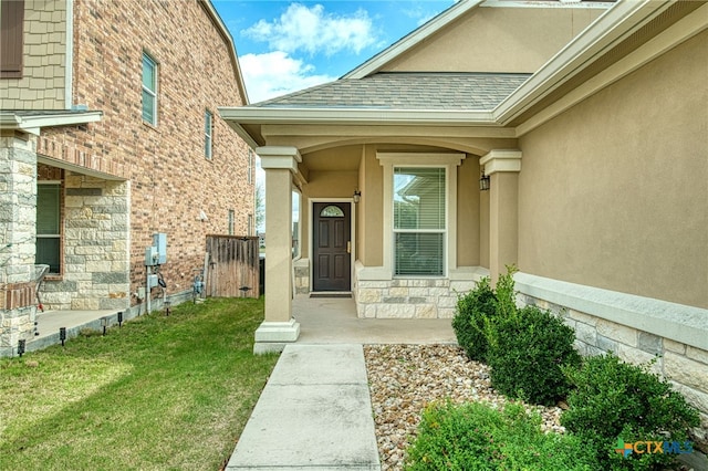 doorway to property featuring a yard