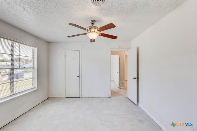 907 Curry Ave, Copperas Cove, TX 76522 - unfurnished bedroom featuring a textured ceiling, baseboards, and ceiling fan