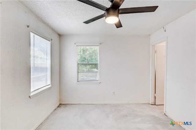 907 Curry Ave, Copperas Cove, TX 76522 - unfurnished room featuring a ceiling fan, unfinished concrete floors, a textured ceiling, and baseboards