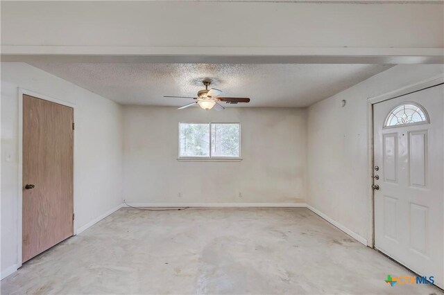 907 Curry Ave, Copperas Cove, TX 76522 - entrance foyer featuring unfinished concrete flooring, a ceiling fan, a textured ceiling, and baseboards