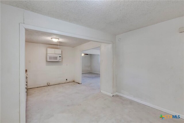 907 Curry Ave, Copperas Cove, TX 76522 - unfurnished room featuring a textured ceiling