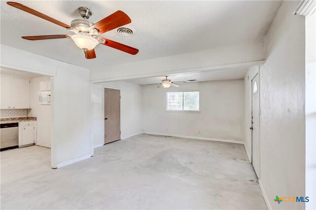 907 Curry Ave, Copperas Cove, TX 76522 - unfurnished living room featuring concrete floors, baseboards, and ceiling fan